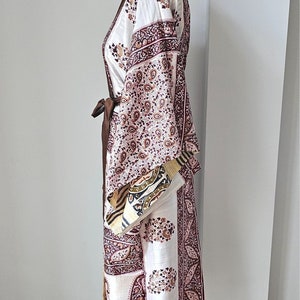 Full length side view of pretty recycled sari dressing gown with long kimono sleeves in paisley print.