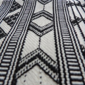Close up of handwoven geometric design cotton living room rug