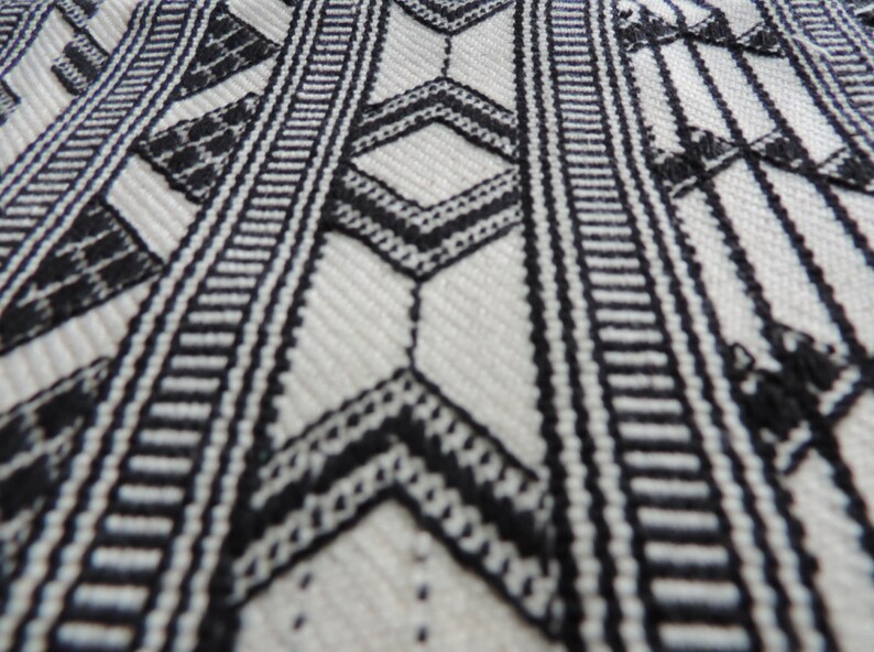 Close up of handwoven geometric design cotton living room rug
