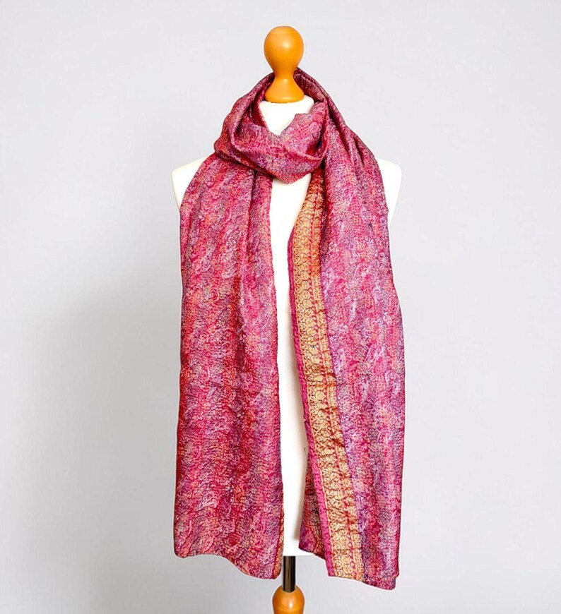 Pretty pink silk scarf with a gold border crafted from recycled sari silk and upcycled with Kantha running stitch to create a lightly quilted look.