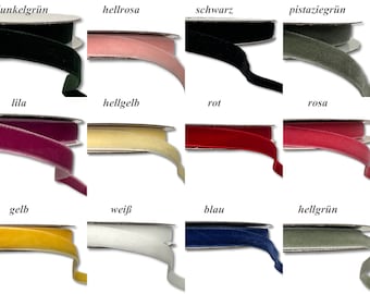 May include: Twelve spools of velvet ribbon in various colours, including dark green, light pink, black, pistachio green, purple, light yellow, red, pink, yellow, white, blue, and light green.