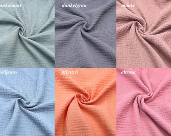 Könnte beinhalten: Sechs Stoffmuster in verschiedenen Farben: Dunkelmint, Dunkelgrau, Mauve, Hellblau, Pfirsich und Rosa.
