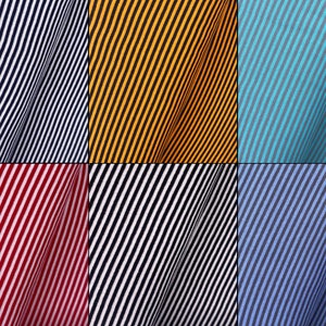 May include: A collection of six fabric swatches with diagonal stripes in various colors, including navy blue, yellow, turquoise, red, black, and blue.