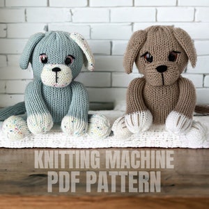 May include: Knitting machine PDF pattern for making two knitted dog toys. One dog is light blue with white paws and the other is brown with white paws.