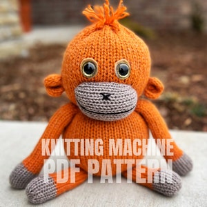May include: Knitting machine PDF pattern for a crocheted orange monkey toy with grey accents and gold eyes.