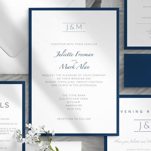May include: Elegant navy blue and white wedding invitation suite. The main invitation features the names "Juliette Freeman and Mark Alan" with event details. Additional cards include RSVP, details, and reception information. The suite is accented with a navy blue border.