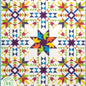 May include: A colorful quilt with a starburst pattern in the center. The quilt is made up of various shades of blue, green, yellow, orange, red, and purple. The quilt is bordered with a teal blue fabric. The quilt is labeled "Powered by SS Quilting".