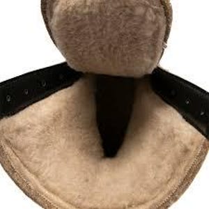 May include: Close-up of a brown boot interior with a soft, beige lining. The boot features a black leather strap with visible stitching and metal eyelets. The interior is designed for warmth and comfort.