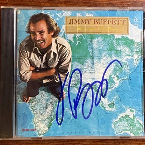 Jimmy Buffett "Somewhere Over China" CD Album Hand Signed In Blue Ink w/ LOA