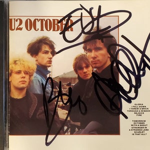 U2 &quot;October&quot; CD Album 3x Hand-Signed Autograph by Bono, The Edge and Adam Clayton w/ LOA