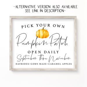 May include: A white sign with a wood frame, featuring the text "Pick Your Own Pumpkin Patch" in black cursive font. A watercolour illustration of a pumpkin is above the text. The sign also includes the text "Open Daily September thru November" and "Hayrides, Corn Maze, Caramel Apples".