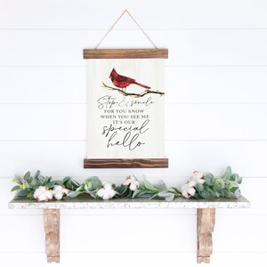 May include: A wooden sign with a red cardinal perched on a branch. The sign reads "Stop & smile for you know when you see me it's our special hello".