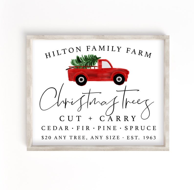May include: A white sign with a red truck carrying a Christmas tree. The sign reads "Hilton Family Farm Christmas Trees Cut + Carry Cedar Fir Pine Spruce $20 Any Tree, Any Size Est. 1963"