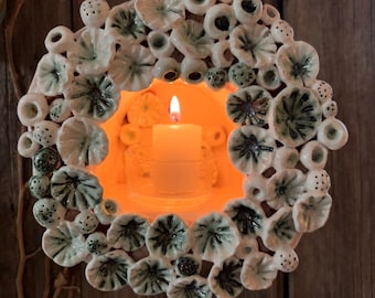 Hand made porcelain candle sconce with sculptural elements