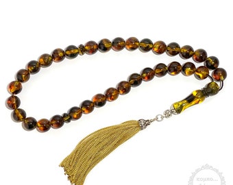 Baltic amber rosary with 33+1 natural amber beads in round shape of 10mm diameter.