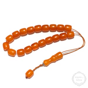 Resin traditional komboloi created with 19+2 resin beads in barrel shape of 13x14mm diameter, 31cm total length, and 45g total weight.