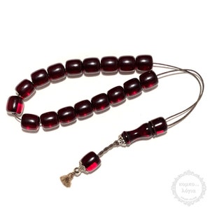 Resin traditional komboloi created with 17+1 resin beads in barrel shape of 13x14mm diameter, 36cm total length, and 42g total weight.
