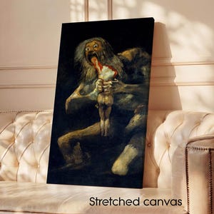 Puede incluir: Una impresión en lienzo estirado de "Saturno devorando a su hijo" de Francisco Goya. La obra de arte representa una escena oscura y dramática de una figura consumiendo a otra. El texto "Stretched canvas" está impreso en la parte inferior.