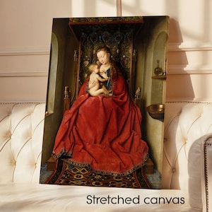 May include: Stretched canvas art print of a Renaissance painting. The artwork depicts a woman in a red robe holding a child. The background features ornate details and a decorative canopy. The text "Stretched canvas" is at the bottom.