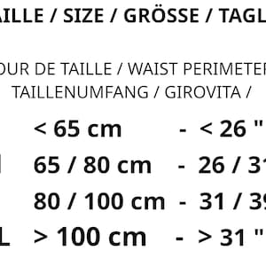 May include: Size chart for clothing with measurements in inches and centimeters. The chart shows sizes S, M, L, and XL with corresponding waist measurements in inches and centimeters.