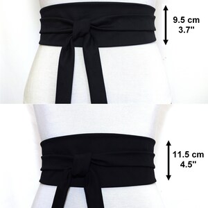 May include: Black fabric belt tied in a bow at the front. The belt is 3.7 inches wide and 4.5 inches wide.