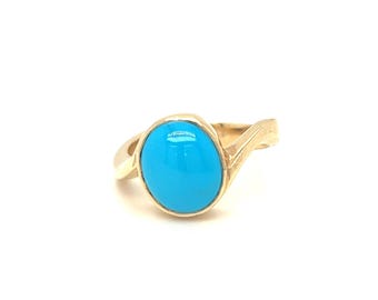 May include: A gold ring with a turquoise gemstone. The ring has a simple, elegant design.