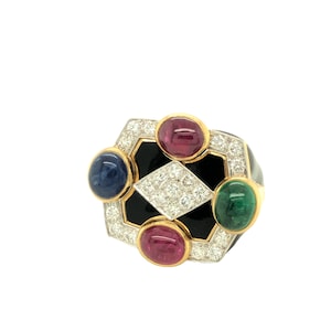 May include: A gold ring with a black enamel center and a diamond-shaped design. The ring is set with four cabochon gemstones: a blue sapphire, two pink rubies, and a green emerald.