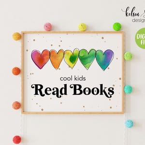 May include: A printable wall art design featuring a row of rainbow watercolor hearts with the text "cool kids Read Books" in black.