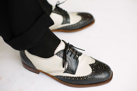 Black and white wingtip derby shoes 