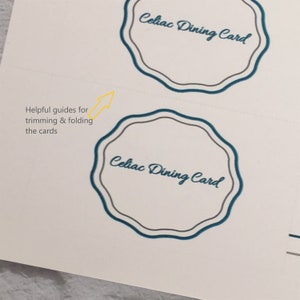 May include: Two white rectangular cards featuring a scalloped-edge frame in teal and gray. The text Celiac Dining Card is printed in teal script. A yellow arrow points to dashed lines with the text Helpful guides for trimming & folding the cards.