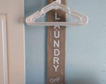 Laundry pipe sign drop drawers hangers clothes room vinyl paint wood washer dryer pallet stain white fence verticle clean hanging dry shirts