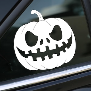 May include: A white pumpkin with a scary, toothy grin. The pumpkin is a Halloween decoration.