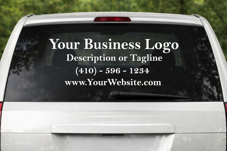 May include: The rear window of a white vehicle features a custom decal. The decal includes the text "Your Business Logo", a space for a description or tagline, a phone number, and a website address, all in a clear, white font.