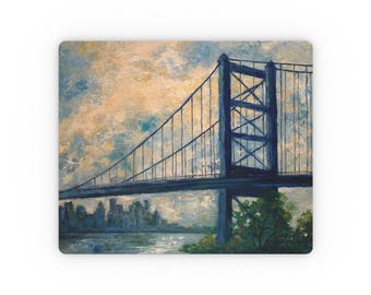May include: A painting of a suspension bridge over a body of water with a city skyline in the background. The bridge is painted in shades of blue and the sky is a light yellow with white clouds.