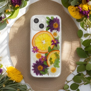 Handcrafted phone case with vibrant orange slices and purple flowers showcasing a summer vibe, perfect for adding a burst of color and nature's charm to your device.