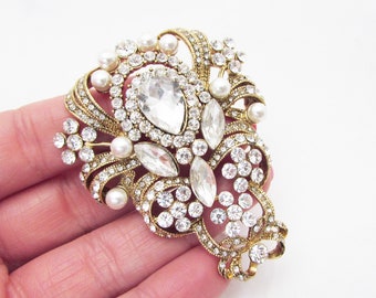 large gold brooch