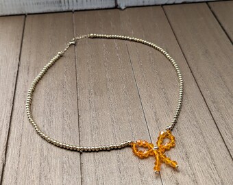 Gold Balls Necklace with Statement Bow Pendant