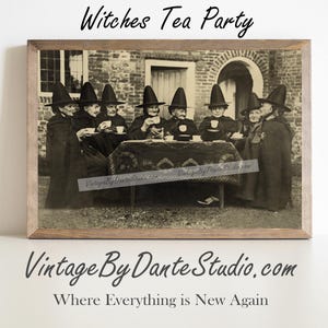 May include: A framed sepia-toned print titled "Witches Tea Party." The image depicts a group of people in black cloaks and tall, pointed hats gathered around a table, holding teacups. The print is from Vintage By Dante Studio.com.