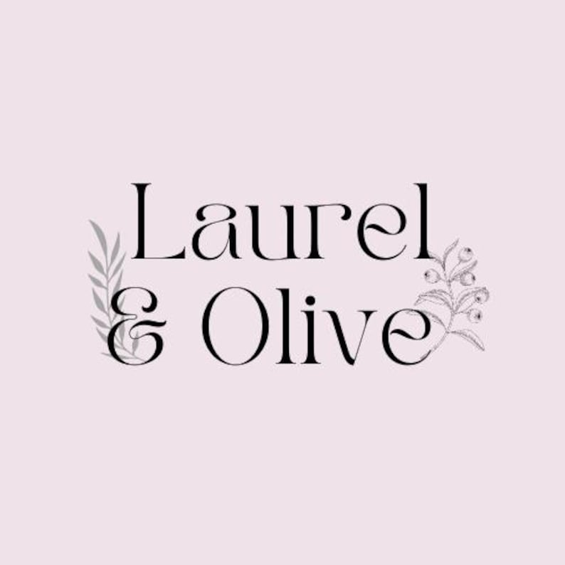 May include: A logo design featuring the words "Laurel & Olive" in a stylish serif font. The text is black against a pale pink background. Decorative botanical illustrations, including leaves and berries, frame the text.