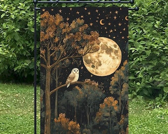 May include: A garden flag featuring a nighttime forest scene with a large full moon, stars, and an owl perched on a tree branch. The flag has a black background with gold and brown accents, creating a whimsical and enchanting design.