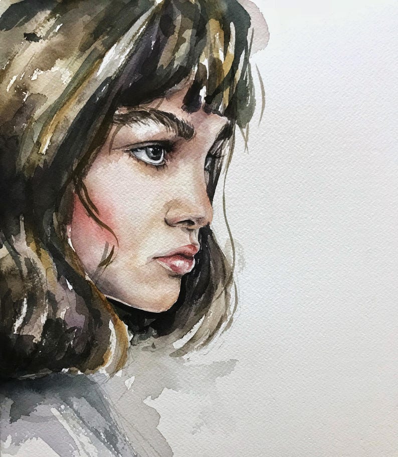 May include: A watercolor painting of a person in profile, featuring dark brown hair with bangs, defined eyebrows, and soft pink cheeks. The artwork uses shades of brown, grey, and muted skin tones on a textured white paper background with visible brushstrokes.