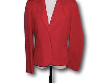 May include: A red blazer with a single button closure and long sleeves. The blazer has a classic, tailored fit.