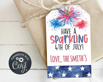 May include: A white gift tag with a watercolor design of red, white, and blue fireworks. The text reads "Have a Sparkling 4th of July! Love, The Smith's".