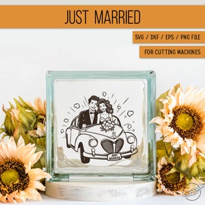 May include: A black and white illustration of a newly married couple driving away in a vintage car with a "Just Married" license plate. The image is on a clear glass block.