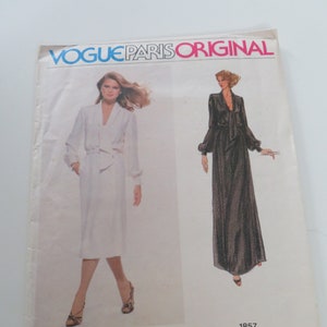 May include: Vogue Paris Original sewing pattern number 1857 for a dress designed by Pierre Balmain. The pattern shows two models wearing the dress in different colors and styles.