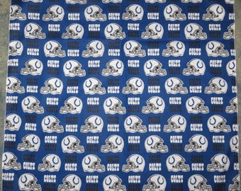 May include: A blue bandana with a repeated pattern of white football helmets with the word "COLTS" printed on them.