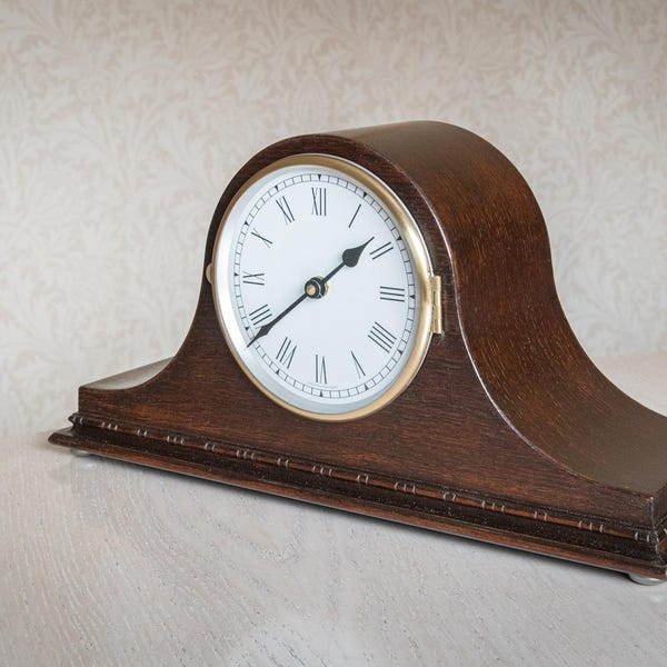 A vintage mantel clock with quartz conversion.