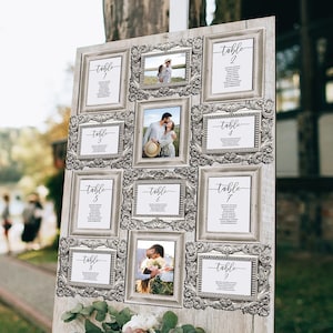 wedding seating chart with silver frames.  each frame displays a seating table card with the table number and guest names.  some of the frames have pictures of the bride and groom. the frame collage is on an easel and display board.