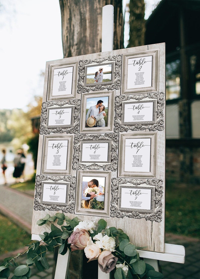 wedding seating chart with silver frames.  each frame displays a seating table card with the table number and guest names.  some of the frames have pictures of the bride and groom. the frame collage is on an easel and display board.