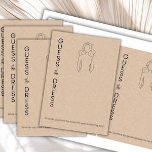 May include: Four brown cards with the text "GUESS THE DRESS" and a line drawing of a woman in a dress. The text "What do you think the bride will wear on her big day?" is printed on each card.